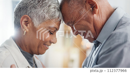 Love, hug and senior couple in their home for support, happy together and affection with laugh or smile. Elderly woman and man with eyes closed for prayer in marriage, mindfulness and romance or care Love, hug and senior couple in their home for support, happy together and affection with laugh or smile. Elderly woman and man with eyes closed for prayer in marriage, mindfulness and romance or care 112377966