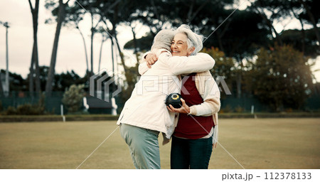 Bowling success, hug and women on a field with teamwork, support and celebration in sport. Happy, win and senior friends excited about a game or competition in a park for retirement hobby together Bowling success, hug and women on a field with teamwork, support and celebration in sport. Happy, win and senior friends excited about a game or competition in a park for retirement hobby together 112378133