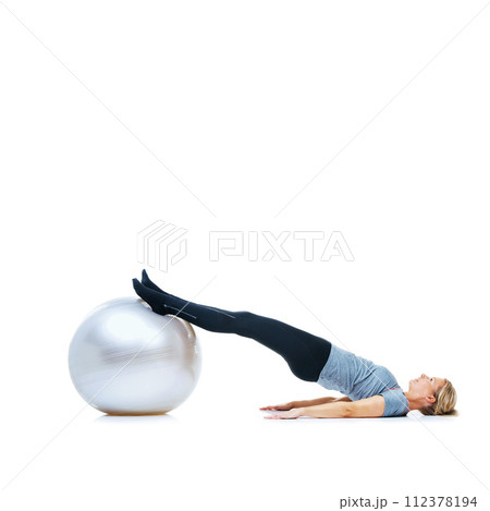 Woman, ball or body balance on space or white background in workout, training or mobility exercise. Female slim athlete, wellness or core fitness for mockup, stretching legs or flexibility in studio Woman, ball or body balance on space or white background in workout, training or mobility exercise. Female slim athlete, wellness or core fitness for mockup, stretching legs or flexibility in studio 112378194