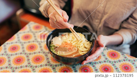 Ramen food, plate and table in restaurant with person, hands and ginger with closeup for Japanese cuisine. Niboshi bowl, chopsticks and pork for diet, nutrition and catering for wellness in Tokyo Ramen food, plate and table in restaurant with person, hands and ginger with closeup for Japanese cuisine. Niboshi bowl, chopsticks and pork for diet, nutrition and catering for wellness in Tokyo 112378195