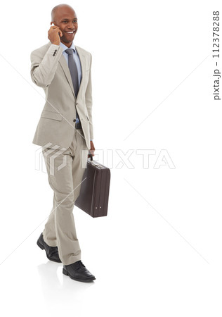 Happy businessman, phone call and walking with suitcase for discussion on a white studio background. Black man or employee smile talking on mobile smartphone with briefcase in conversation on mockup Happy businessman, phone call and walking with suitcase for discussion on a white studio background. Black man or employee smile talking on mobile smartphone with briefcase in conversation on mockup 112378288