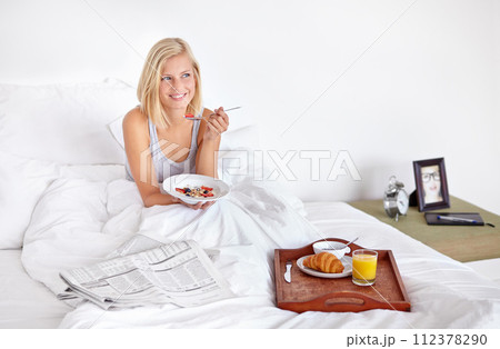 Smile, thinking and food with woman in bed of hotel to wake up for morning hospitality or accommodation. Relax, breakfast and vacation with happy young blonde person in bedroom of home on weekend Smile, thinking and food with woman in bed of hotel to wake up for morning hospitality or accommodation. Relax, breakfast and vacation with happy young blonde person in bedroom of home on weekend 112378290