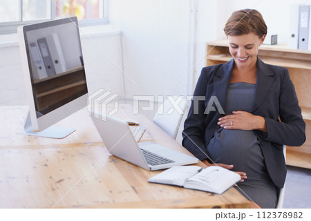 Happy business woman, pregnant and office with laptop in joy for motherhood at workplace. Female person or employee touching stomach or tummy with smile for pregnancy by computer desk in maternity Happy business woman, pregnant and office with laptop in joy for motherhood at workplace. Female person or employee touching stomach or tummy with smile for pregnancy by computer desk in maternity 112378982