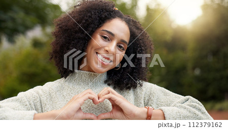 Face, smile and woman with heart hands, outdoor and support with emoji, kindness and wellness. Portrait, female person or happy girl with symbol for love, self care or peace with trust, park and care Face, smile and woman with heart hands, outdoor and support with emoji, kindness and wellness. Portrait, female person or happy girl with symbol for love, self care or peace with trust, park and care 112379162