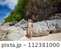 Beautiful young woman in a tunic 112381000