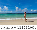 Beautiful young woman on the background of the Bali island sea 112381001