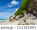Beautiful young woman in a swimsuit in Bali 112381003