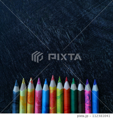 Bright colored pencils on dark background. Back to school mockup. 112381041