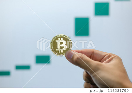 Bitcoin's uptrend and bullish Trend with a Trading Graph in the background. Bitcoin's uptrend and bullish Trend with a Trading Graph in the background. 112381799