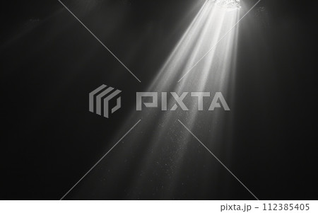 A single beam of light piercing through darkness, symbolizing hope and the possibility of finding a way out of the shadow of addiction and overdose A single beam of light piercing through darkness, symbolizing hope and the possibility of finding a way out of the shadow of addiction and overdose 112385405