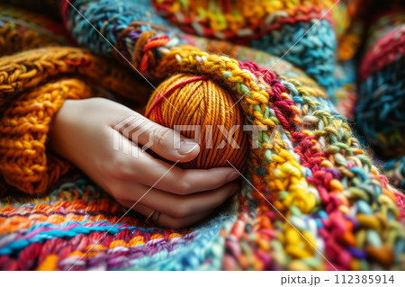 Cozy variety of colorful yarn for knitting and unfinished knitted work. The concept of hobby and comfort. Generative AI 112385914