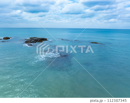 Amazing nature seashore landscape background,Aerial view waves crashing on beach ocean background 112387345