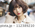 street snapshot image of beautiful young Asian woman with short bob haircut 112389210