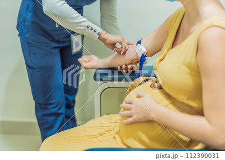 pregnant woman undergoes a blood test, a pivotal step in ensuring the well-being of both herself and her developing baby during the maternity journey pregnant woman undergoes a blood test, a pivotal step in ensuring the well-being of both herself and her developing baby during the maternity journey 112390031