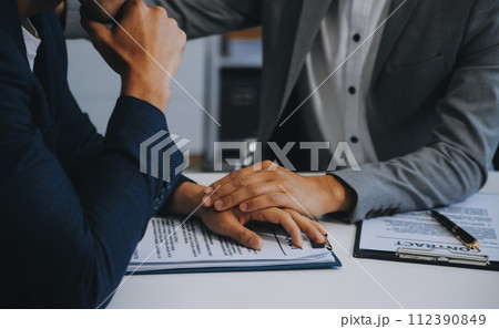 Consultation and conference of Male lawyers and professional businesswoman working and discussion having at law firm in office. Concepts of law, Judge gavel with scales of justice. Consultation and conference of Male lawyers and professional businesswoman working and discussion having at law firm in office. Concepts of law, Judge gavel with scales of justice. 112390849