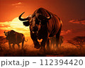 AI-generated content. Serene african landscape. majestic buffaloes grazing in the golden savanna at sunset AI-generated content. Serene african landscape. majestic buffaloes grazing in the golden savanna at sunset 112394420
