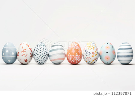A row of colorful pastel Easter eggs, each uniquely painted with different texture on a white background A row of colorful pastel Easter eggs, each uniquely painted with different texture on a white background 112397871