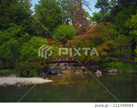Japanese park in Vienna on a summer day. Zetagaya Park is small, quiet Japanese garden with cherry trees and fish pond, open to public from April to October. 112399084
