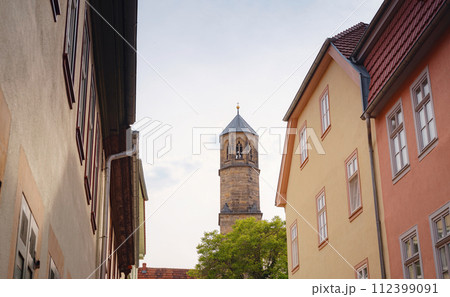 spring trip to Europe. Travel and German sightseeing locations. interesting ancient towers and facades of medieval houses somewhere in Erfurt city 112399091
