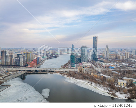 Yekaterinburg aerial panoramic view in spring at sunset. Yekaterinburg city and pond in spring or autumn. Yekaterinburg aerial panoramic view in spring at sunset. Yekaterinburg city and pond in spring or autumn. 112401243
