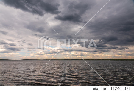 Blue lake with cloudy sky, natural background 112401371