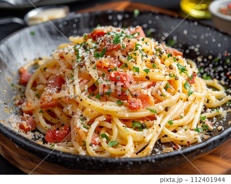 Spaghetti tossed with ripe tomatoes, a sprinkle of Parmesan, and fresh herbs. Generative AI. 112401944