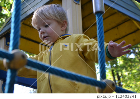 Kids having fun in ferris wheel with chains, carousel ski flyer in amusement park in Targoviste, Romania, 2020. High quality photo Kids having fun in ferris wheel with chains, carousel ski flyer in amusement park in Targoviste, Romania, 2020. High quality photo 112402241