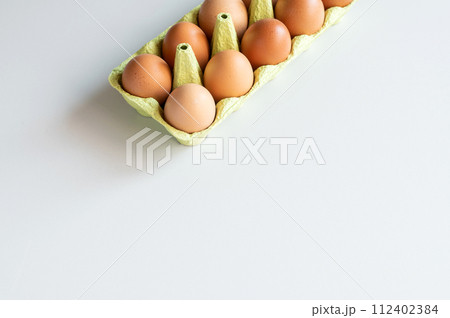 Eggs from egg tray isolated on white background. 112402384