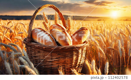 Wicker Basket Full of Loaves of Bread in a Wheat Field - Generative Ai 112402578