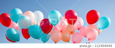 AI-generated content. Hands holding colorful balloons against blue sky, concept of celebration and joy 112404048