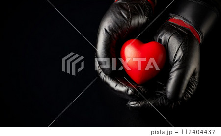 Black Boxing Gloves Holding a Red Heart on a Black Background - Generative Ai 112404437