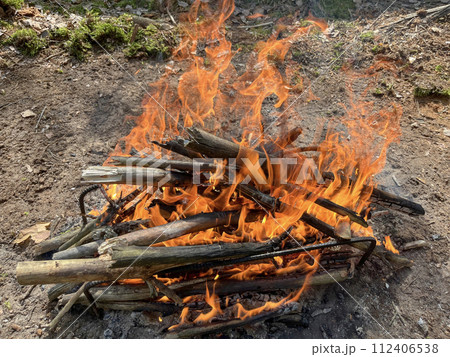 a barbecue campfire is built in the forest 112406538