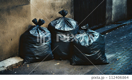 Black Garbage Bags Abandoned on a City Street - Generative Ai 112406864