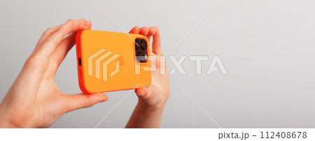 Berlin Germany January 21 2024 mobile phone, taking photo with smartphone camera. Banner background 112408678