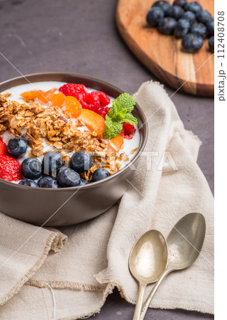 Yogurt with baked granola and berries Yogurt with baked granola and berries 112408708