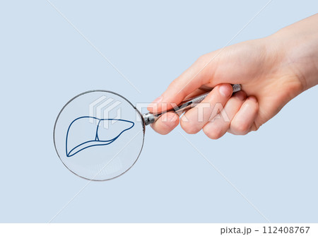 Liver health, study through magnifying glass Liver health, study through magnifying glass 112408767