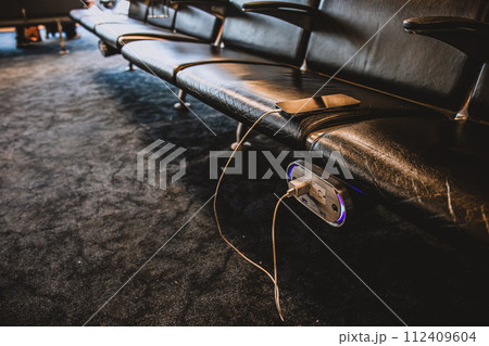 Selective focus on airport terminal phone charging outlet station Selective focus on airport terminal phone charging outlet station 112409604
