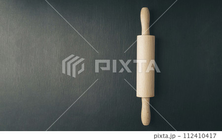close up of various baking utensils for baking cookies , like rolling pin whisk and baking pan close up of various baking utensils for baking cookies , like rolling pin whisk and baking pan 112410417