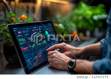 Man adjusting temperature through home automation 112415174