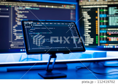 Work from home. Programmer coding code on notebook screen at home. Work from home. Programmer coding code on notebook screen at home. 112419702