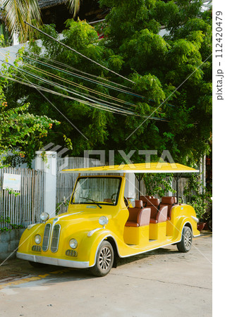yellow car on the beach yellow car on the beach 112420479