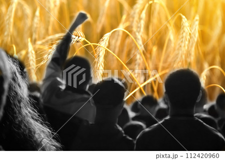 Farmers protest concept. Crowd of people on wheat background. Farmers' protests in Europe and world Farmers protest concept. Crowd of people on wheat background. Farmers' protests in Europe and world 112420960