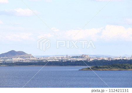 A view of the Edinburgh skyline from the Firth of Forth.  The castle can be seen dominating the skyline.  Edinburgh is the capital city of Scotland. 112421131