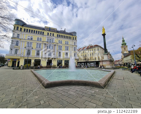 Graz, Austria - 26.03.2023: Mary's Column and fountain in Jakominiplatz Square, famous attraction in the city center of Graz, Steiermark region, Austria. 112422289
