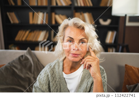 Portrait of confident stylish European middle aged senior woman. Older mature 60s lady smiling at home. Happy attractive senior female looking camera close up face headshot portrait. Happy people 112422741