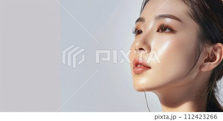 Young Asian woman portrait showcasing her skin care with a a copy space background Young Asian woman portrait showcasing her skin care with a a copy space background 112423266