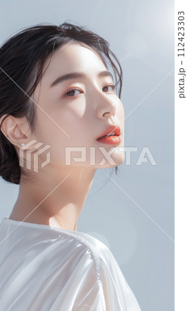Young Asian woman portrait showcasing her skin care with a a copy space background Young Asian woman portrait showcasing her skin care with a a copy space background 112423303