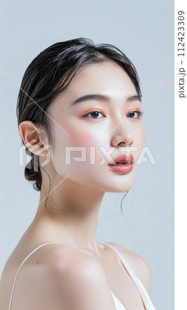 Young Asian woman portrait showcasing her skin care with a a copy space background Young Asian woman portrait showcasing her skin care with a a copy space background 112423309