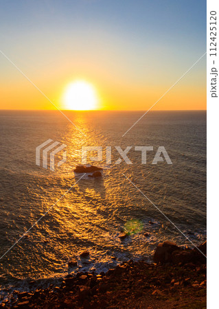 View of the Atlantic Ocean from Cabo da Roca at sunset. Cabo da Roca or Cape Roca is westernmost cape of mainland Portugal, continental Europe and the Eurasian land mass 112425120