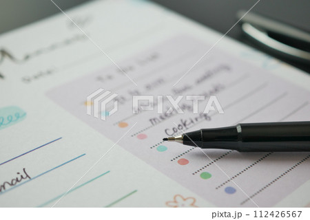 high angle view of weekly planner on table. 112426567